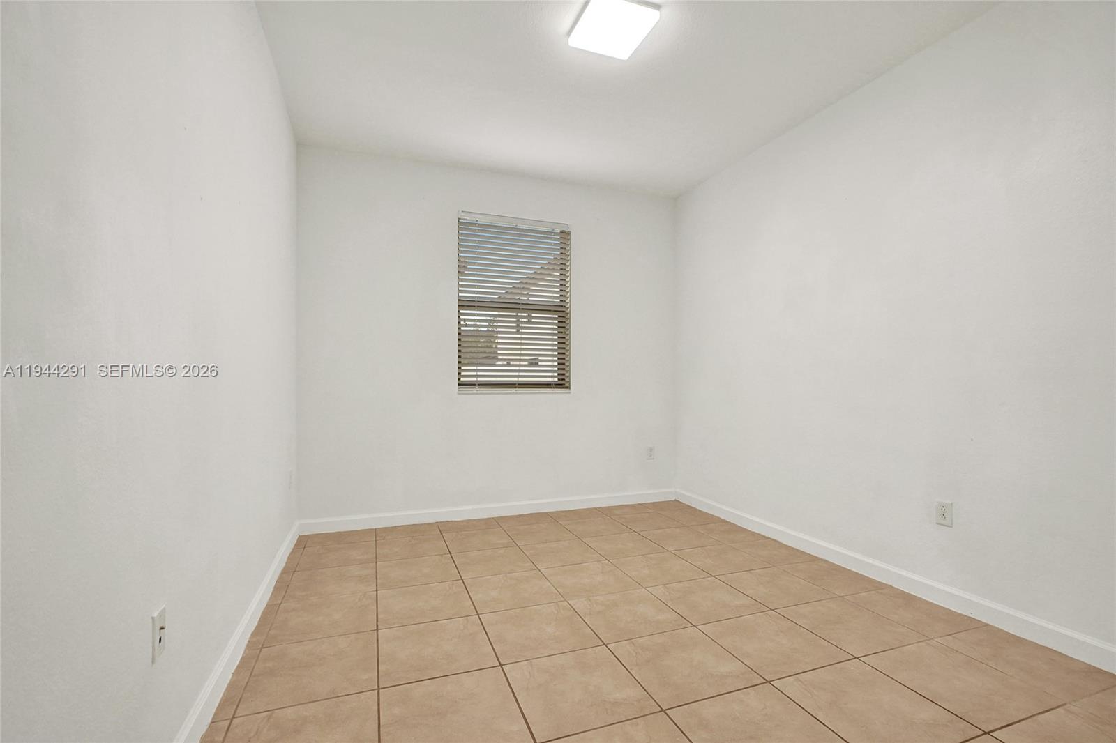 3504 West 94th Street Hialeah, FL 33018 - Photo 19 of 61 an empty room with a bench