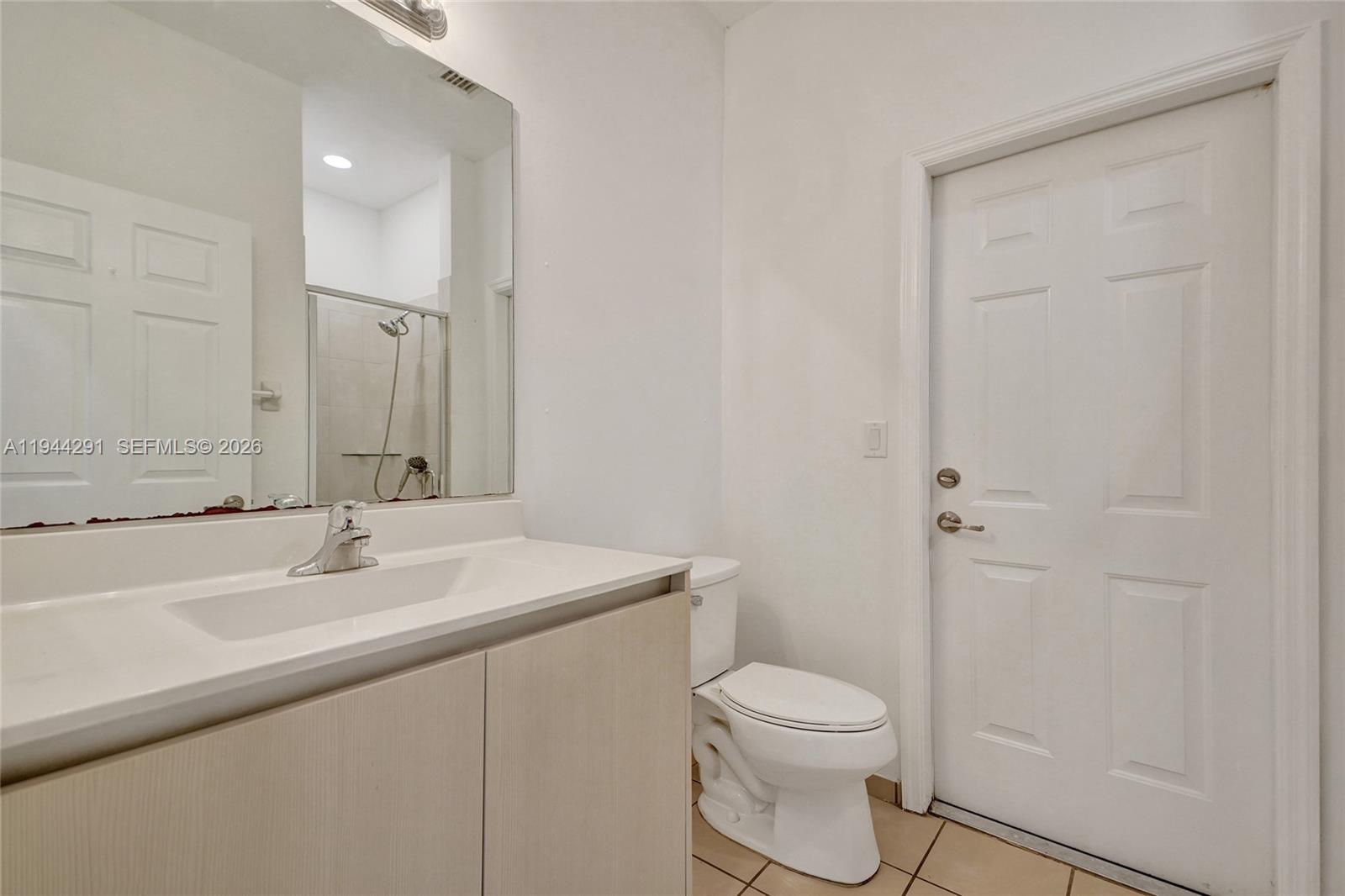 3504 West 94th Street Hialeah, FL 33018 - Photo 22 of 61 a bathroom with a sink a toilet and shower