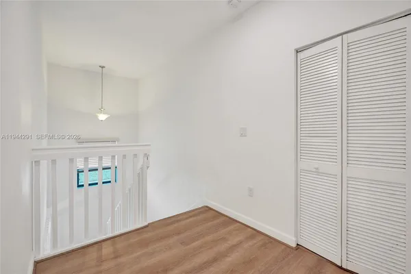 a bathroom with a bathtub shower sink and mirror