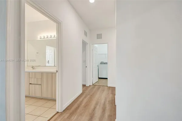 a bathroom with a bathtub a shower a sink and mirror