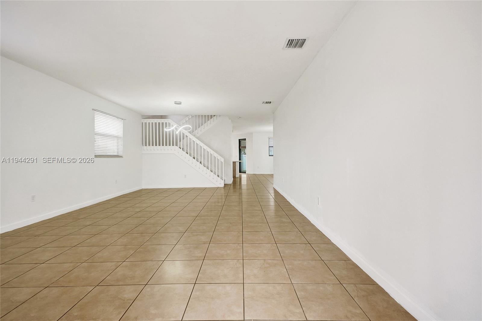 3504 West 94th Street Hialeah, FL 33018 - Photo 3 of 61 a view of a hallway with stairs