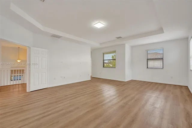 a white bath tub sitting next to a white toilet