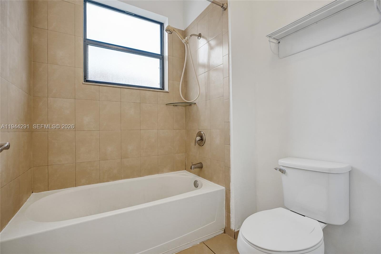 3504 West 94th Street Hialeah, FL 33018 - Photo 41 of 61 a white bath tub sitting next to a white toilet