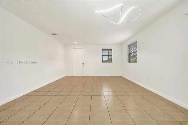 a view of an empty room with stairs