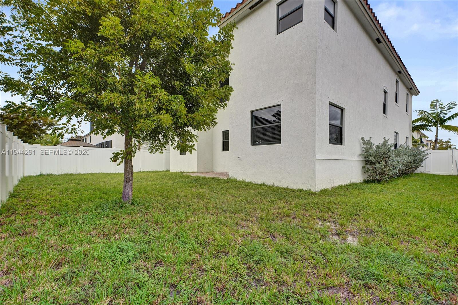 3504 West 94th Street Hialeah, FL 33018 - Photo 60 of 61 a white house that has a tree in front of it