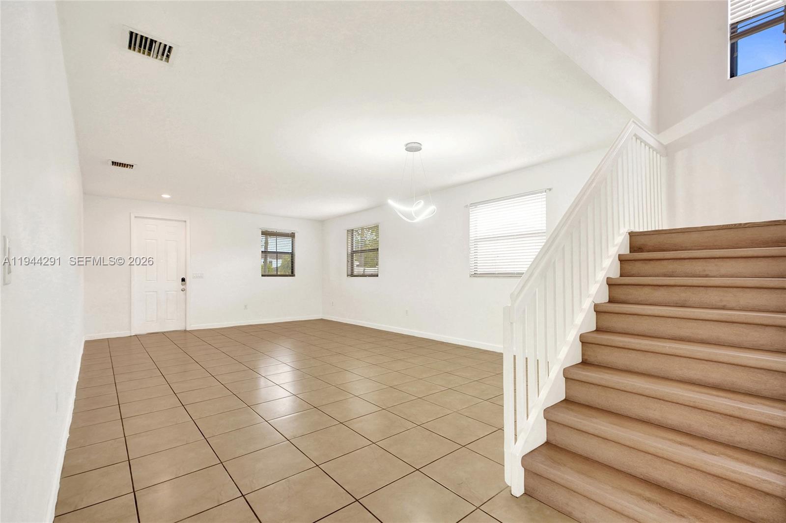 3504 West 94th Street Hialeah, FL 33018 - Photo 6 of 61 a view of an empty room with stairs