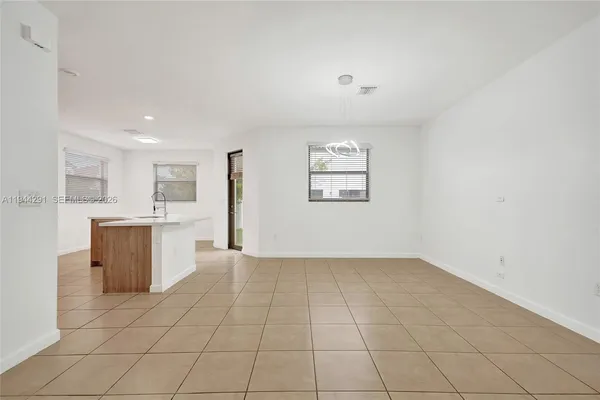 a kitchen with stainless steel appliances a sink and a refrigerator