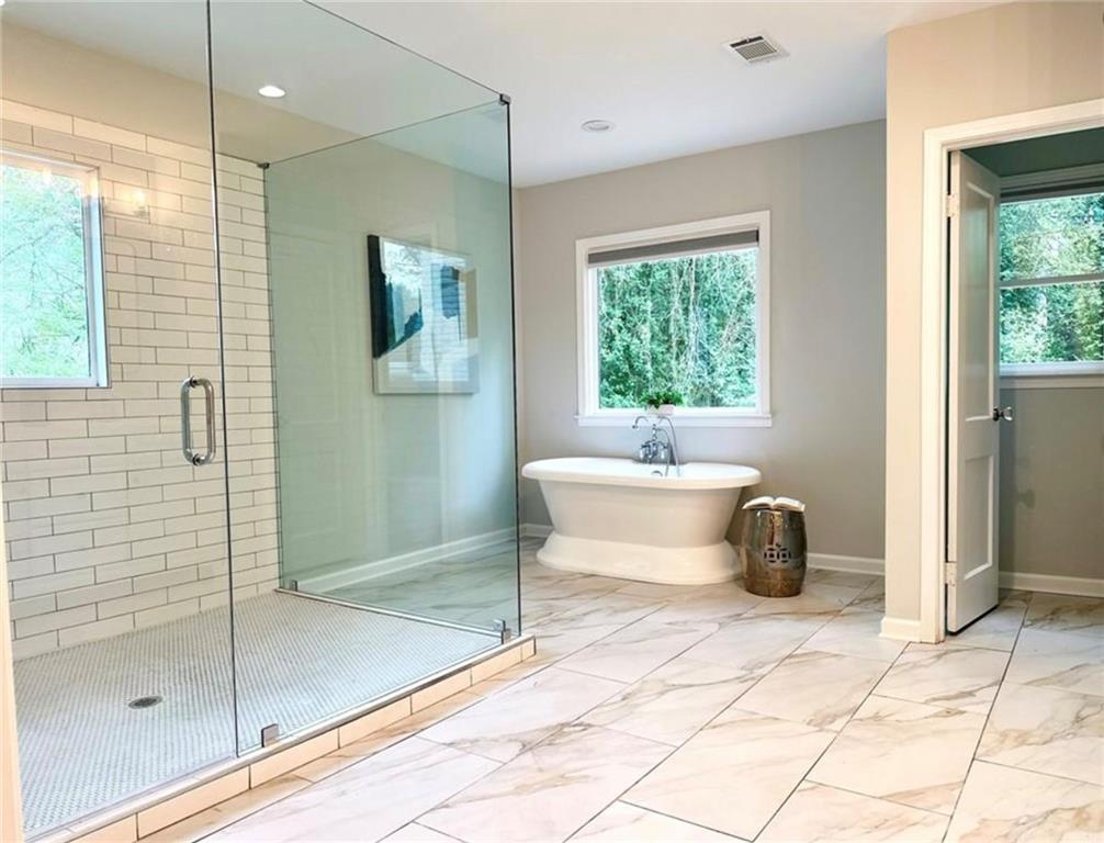 2222 Beecher Road Southwest Atlanta, GA 30311 - Photo 12 of 15 a spacious bathroom with a tub and shower