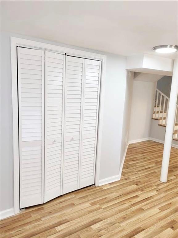 2222 Beecher Road Southwest Atlanta, GA 30311 - Photo 15 of 15 a view of a room with wooden floor and white wall