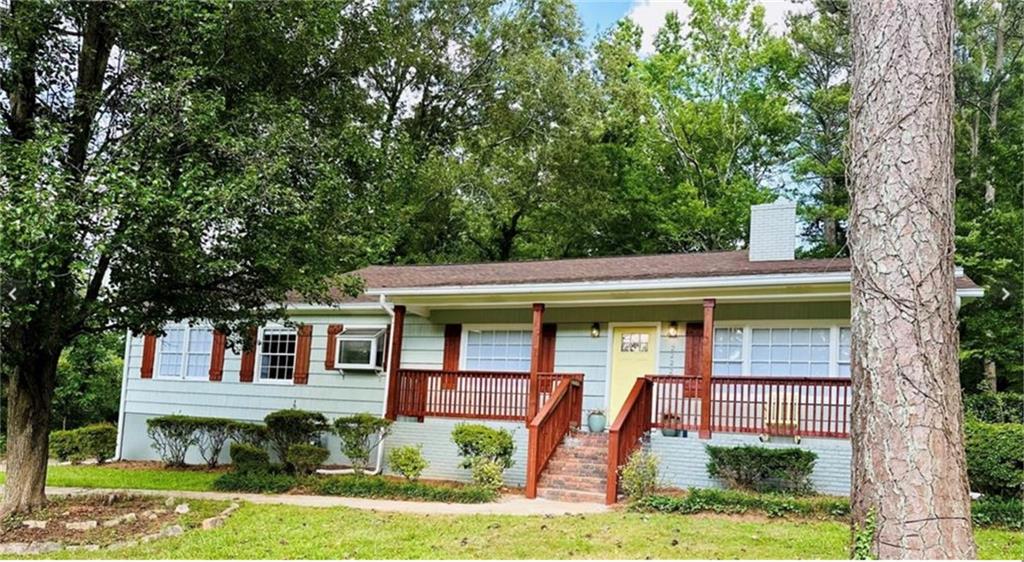 2222 Beecher Road Southwest Atlanta, GA 30311 - Photo 2 of 15 front view of house with a yard