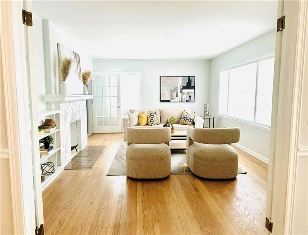 2222 Beecher Road Southwest Atlanta, GA 30311 - Photo 5 of 15 a living room with furniture and a flat screen tv