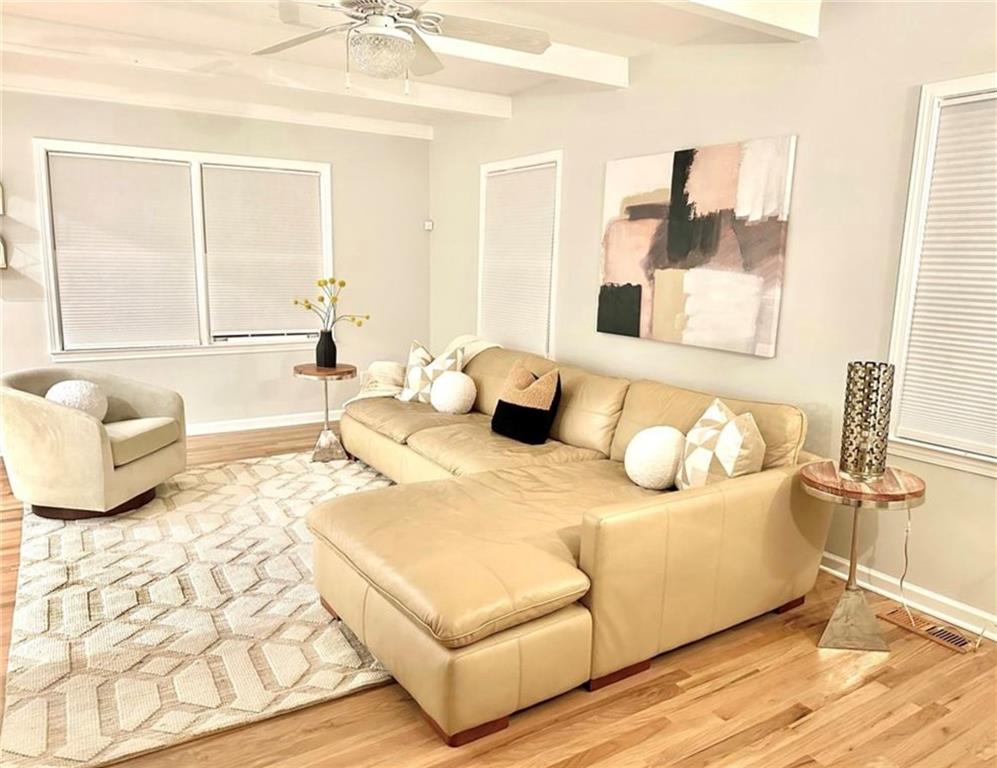 2222 Beecher Road Southwest Atlanta, GA 30311 - Photo 7 of 15 a bedroom with a bed and wooden floor