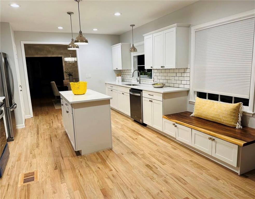 2222 Beecher Road Southwest Atlanta, GA 30311 - Photo 8 of 15 a kitchen with a sink a stove top oven and cabinets