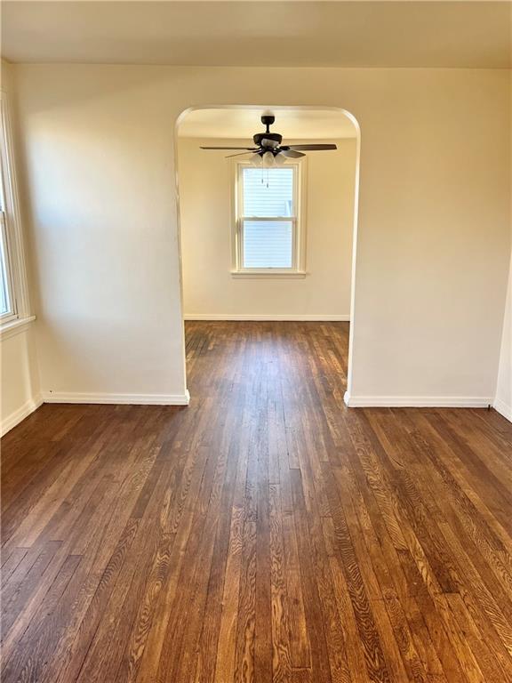 216 Bettis Road Dravosburg, PA 15034 - Photo 5 of 10 an empty room with wooden floor cabinet and windows