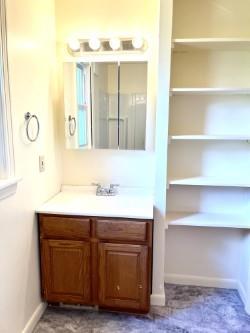 216 Bettis Road Dravosburg, PA 15034 - Photo 6 of 10 a bathroom with a sink vanity granite and a mirror