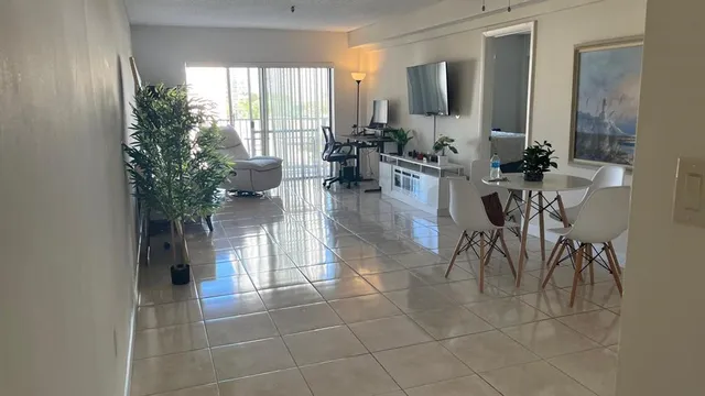 a lobby with furniture and a potted plant