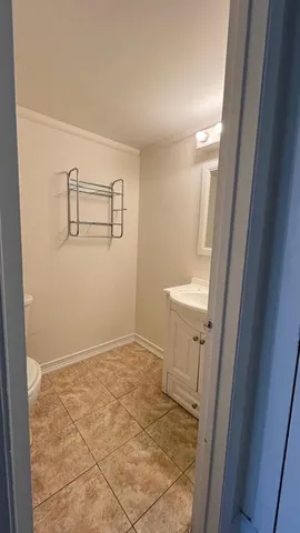 a view of a bathroom with sink and mirror