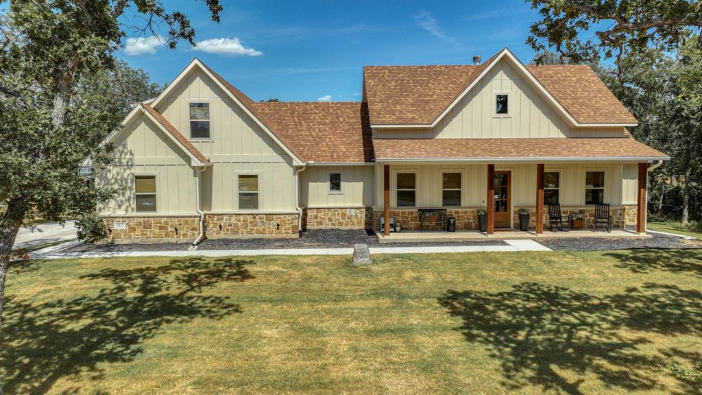 2028 Feather Lane Weatherford, TX 76088 - Photo 1 of 1 a front view of a house with a yard outdoor seating and garage
