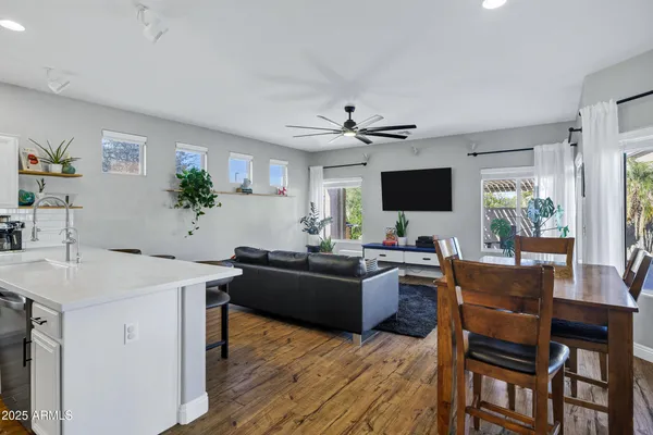 a living room with furniture and kitchen view
