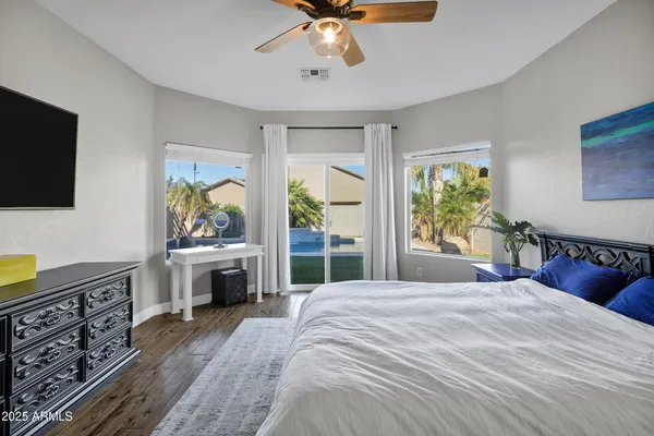 a bathroom with a sink double vanity granite tub shower and a mirror