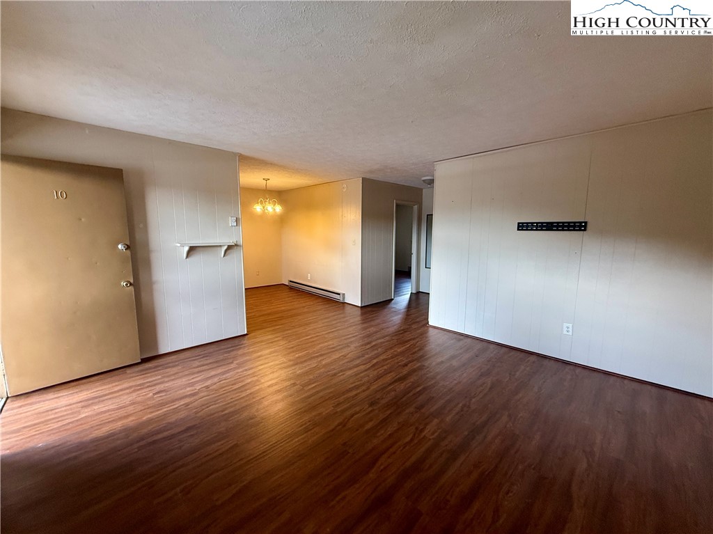 134 Mac Street, Unit 10 Boone, NC 28607 - Photo 11 of 15 a view of empty room with wooden floor