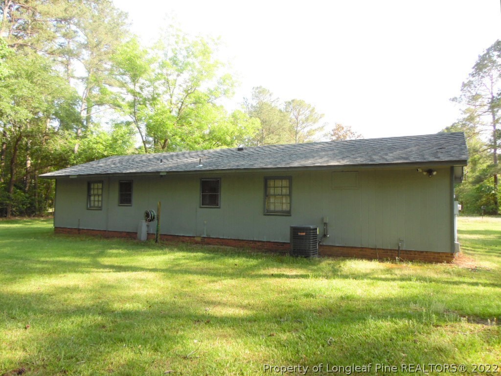 6799 Faircloth Bridge Road Stedman, NC 28391 - Photo 25 of 25 a backyard of a house