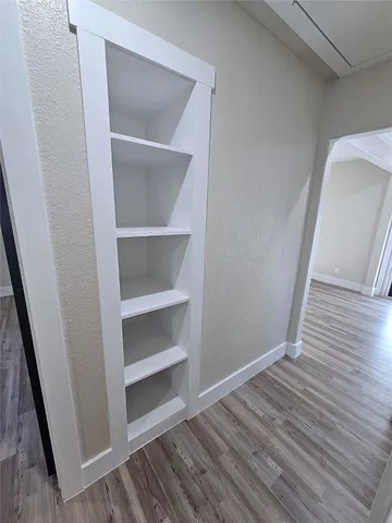 a view of an empty walk in closet