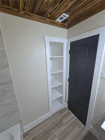 a view of an empty walk in closet