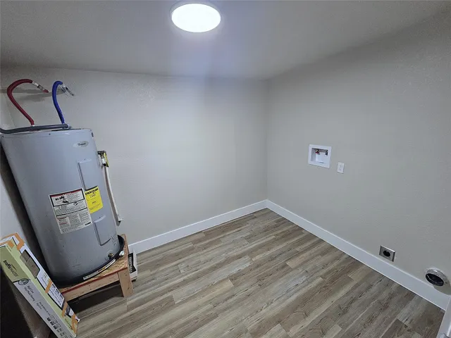 a view of room with wooden floor