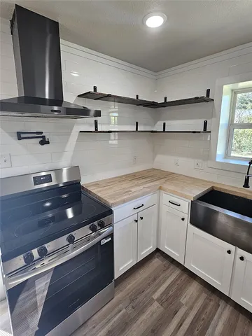 a kitchen with a stove and a sink