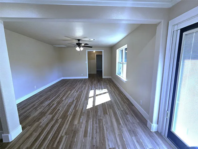 a view of gallery with wooden floor