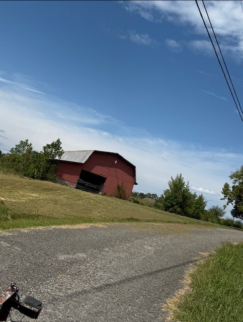 0 Love Road McMinnville, TN 37110 - Photo 7 of 8 a front view of a house with a yard and garage