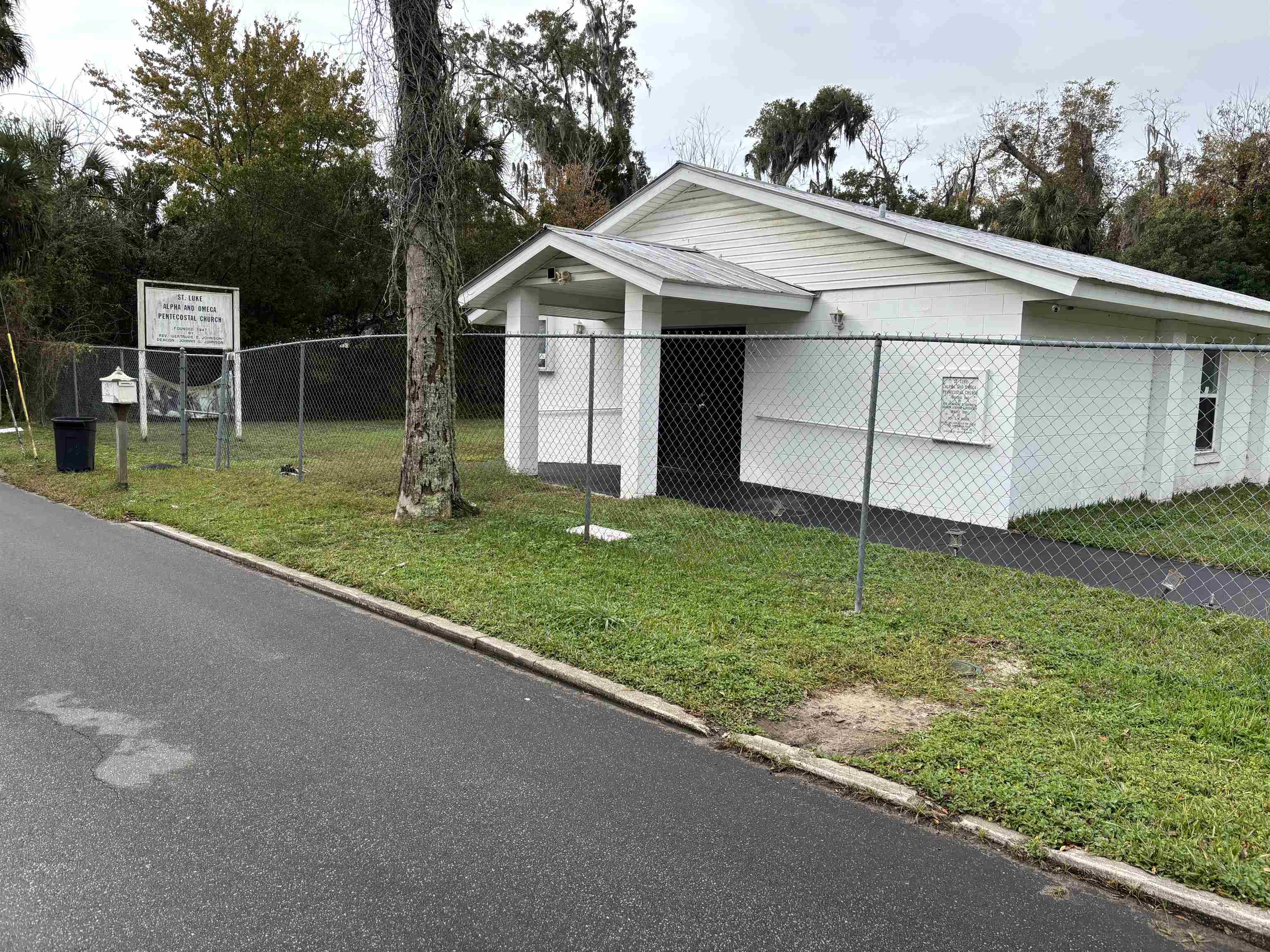 18 Spring Street St. Augustine, FL 32084 - Photo 1 of 1 a view of a white house with a big yard and large tree