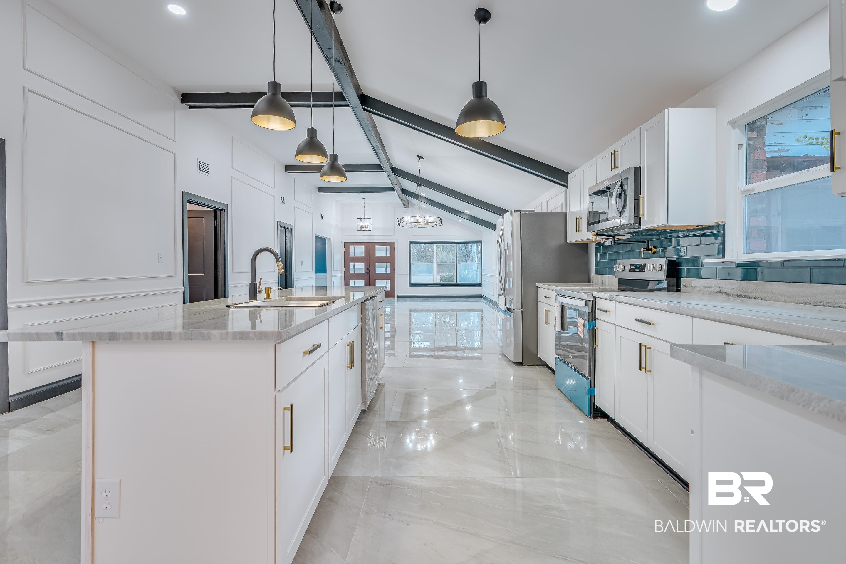 1190 Military Road Mount Vernon, AL 36560 - Photo 9 of 47 Kitchen featuring stainless steel appliances, white cabinetry, light stone counters, hanging light fixtures, and decorative backsplash