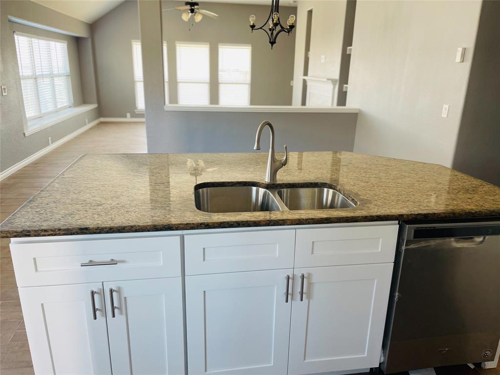 548 Kerry Street Crowley, TX 76036 - Photo 9 of 35 a kitchen with sink and window