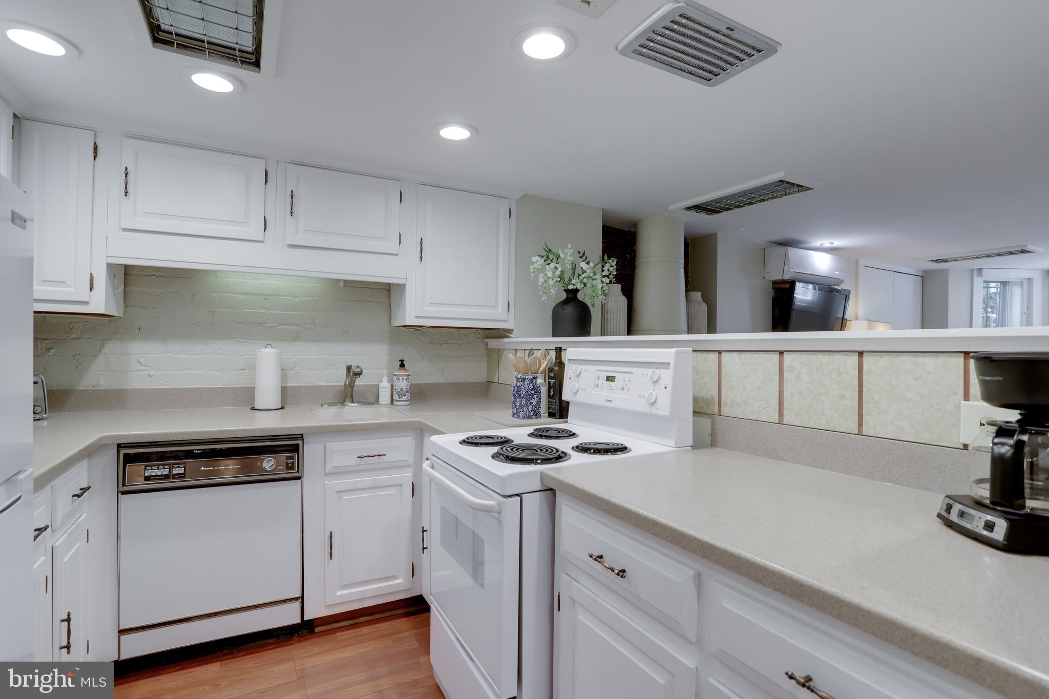 1010 Independence Avenue Southeast, Unit B Washington, DC 20003 - Photo 11 of 17 a kitchen with a sink stove and cabinets