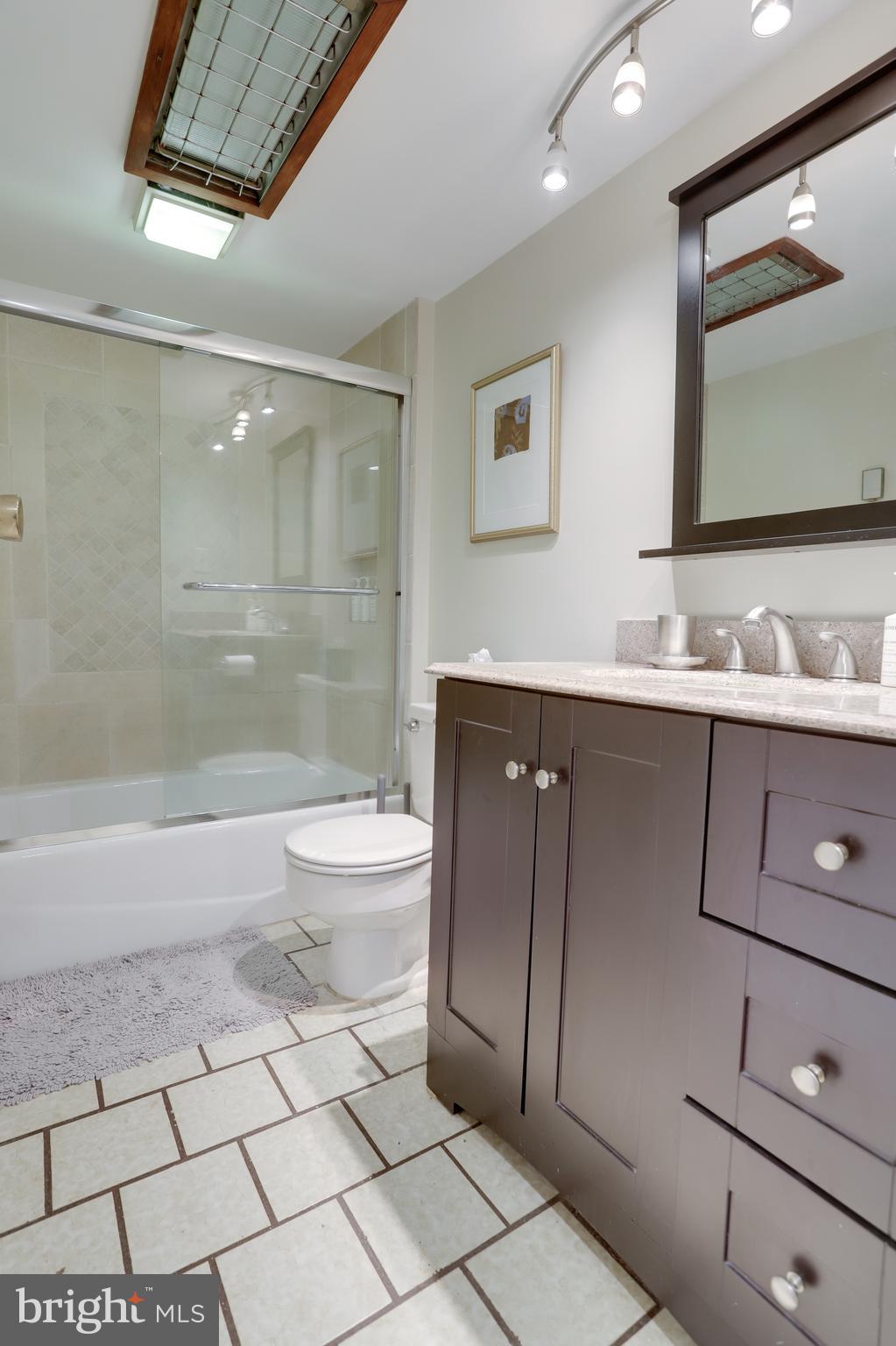 1010 Independence Avenue Southeast, Unit B Washington, DC 20003 - Photo 13 of 17 a bathroom with a sink a toilet and shower