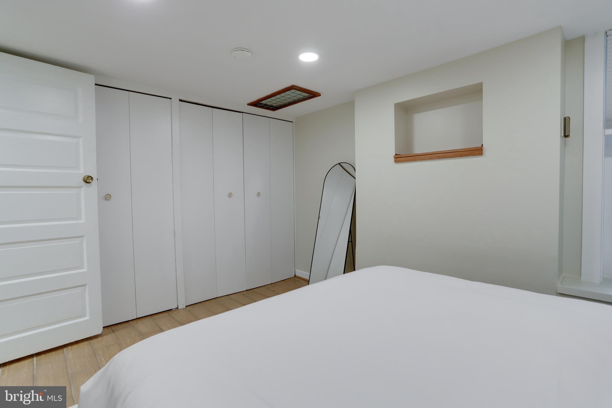 1010 Independence Avenue Southeast, Unit B Washington, DC 20003 - Photo 15 of 17 a bedroom with a bed and a shower