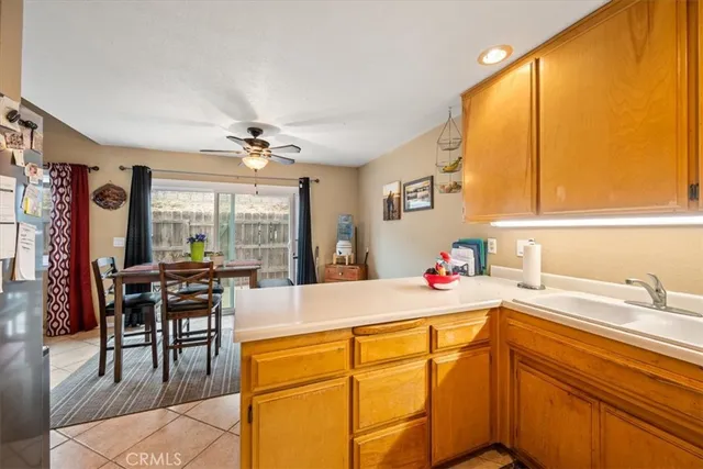 a kitchen with a stove a sink and cabinets
