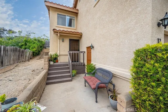 a view of house with chairs and a table