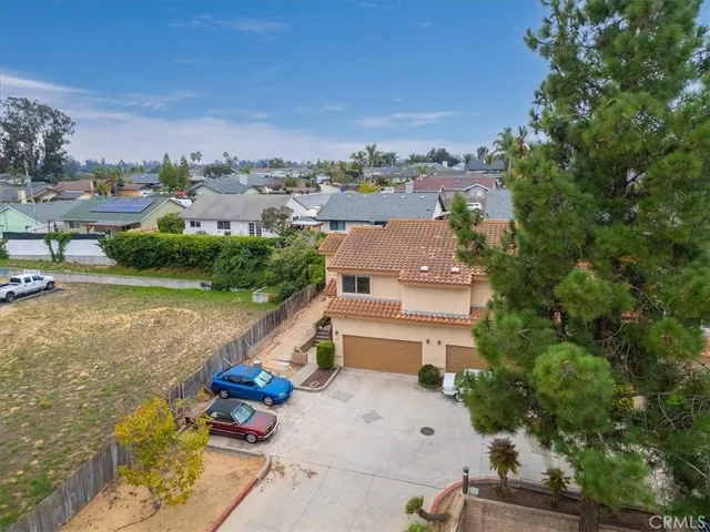 an aerial view of a house with a garden