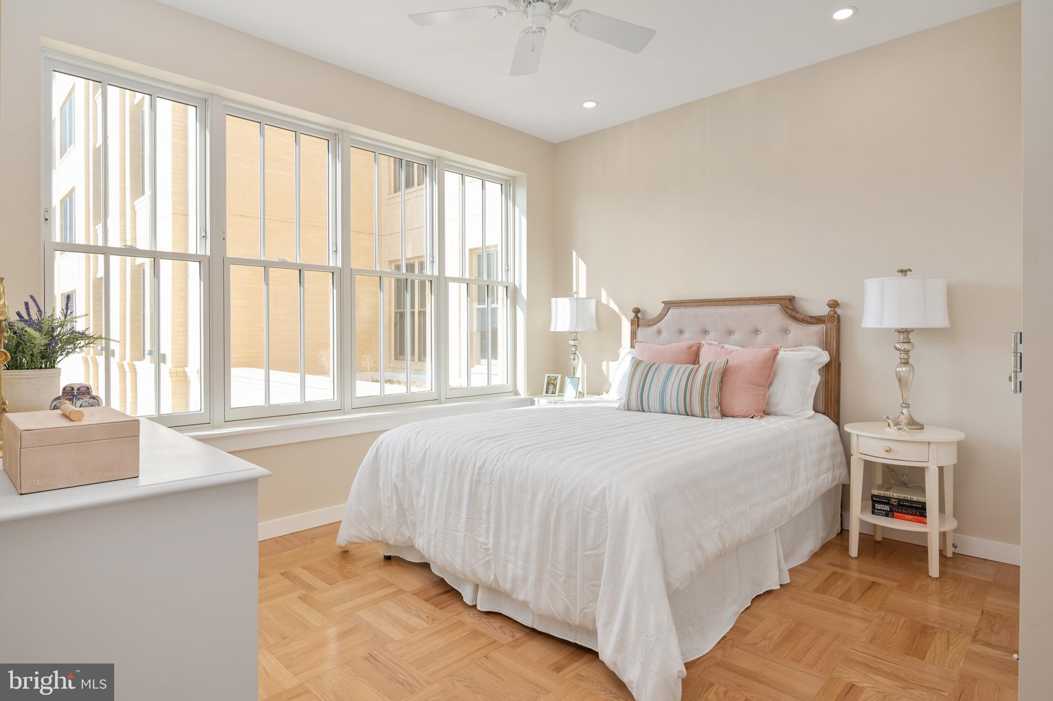 10339 Old Georgetown Road, Unit 516 Bethesda, MD 20814 - Photo 19 of 61 a bedroom with a large bed and a large window