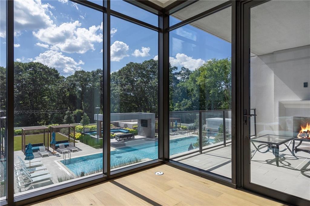 2520 Peachtree Road Northwest, Unit 403 Atlanta, GA 30305 - Photo 20 of 52 a view of a balcony with floor to ceiling windows wooden floor