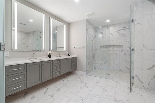 a bathroom with a bathtub and a shower