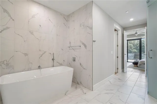a view of a hallway with wooden floor and door