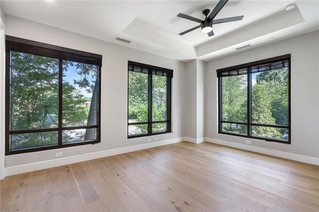 a view of an empty room with glass door