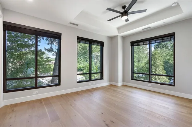 a view of an empty room with glass door