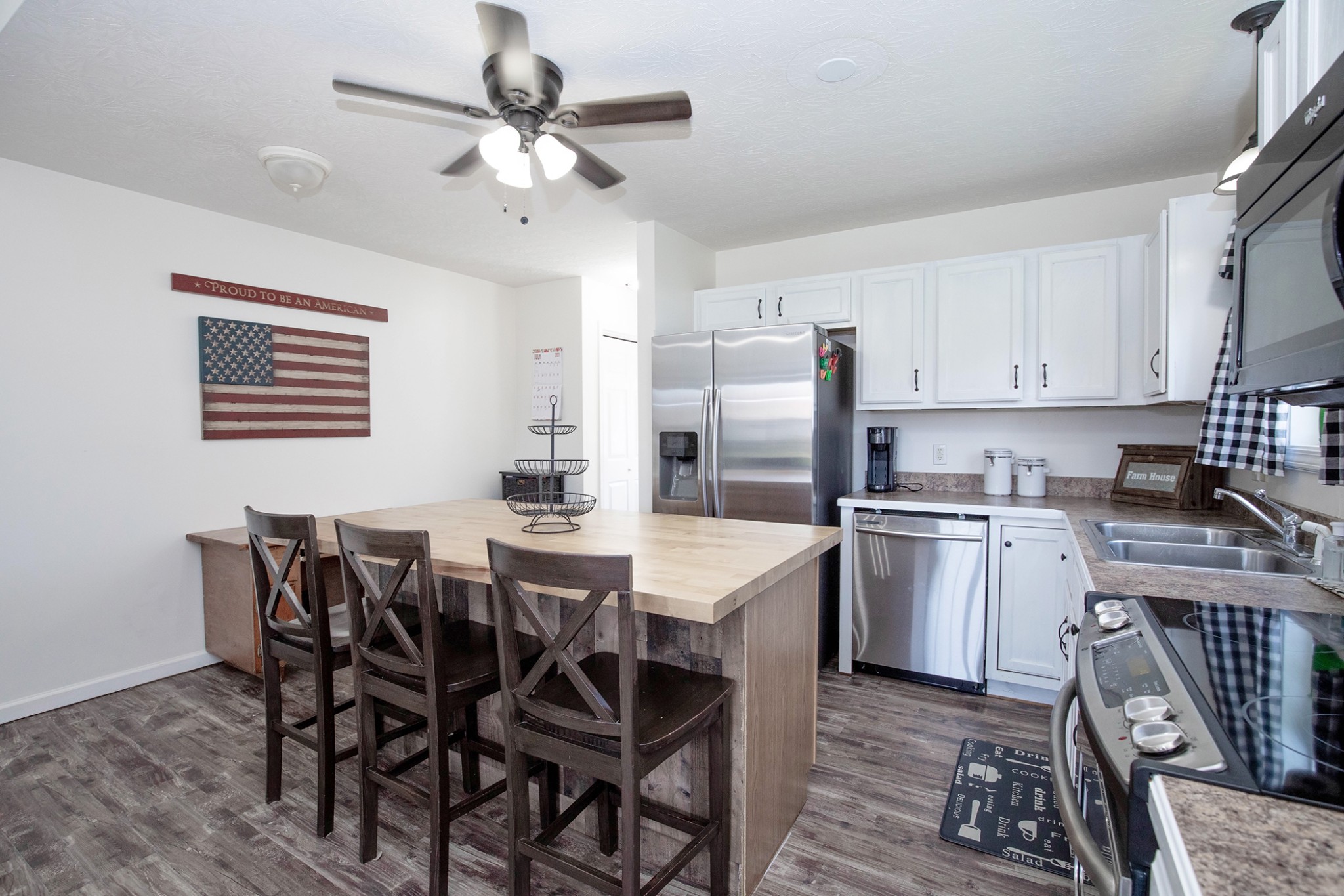 148 Filly Lane Springfield, TN 37172 - Photo 12 of 33 a kitchen with a dining table chairs and refrigerator
