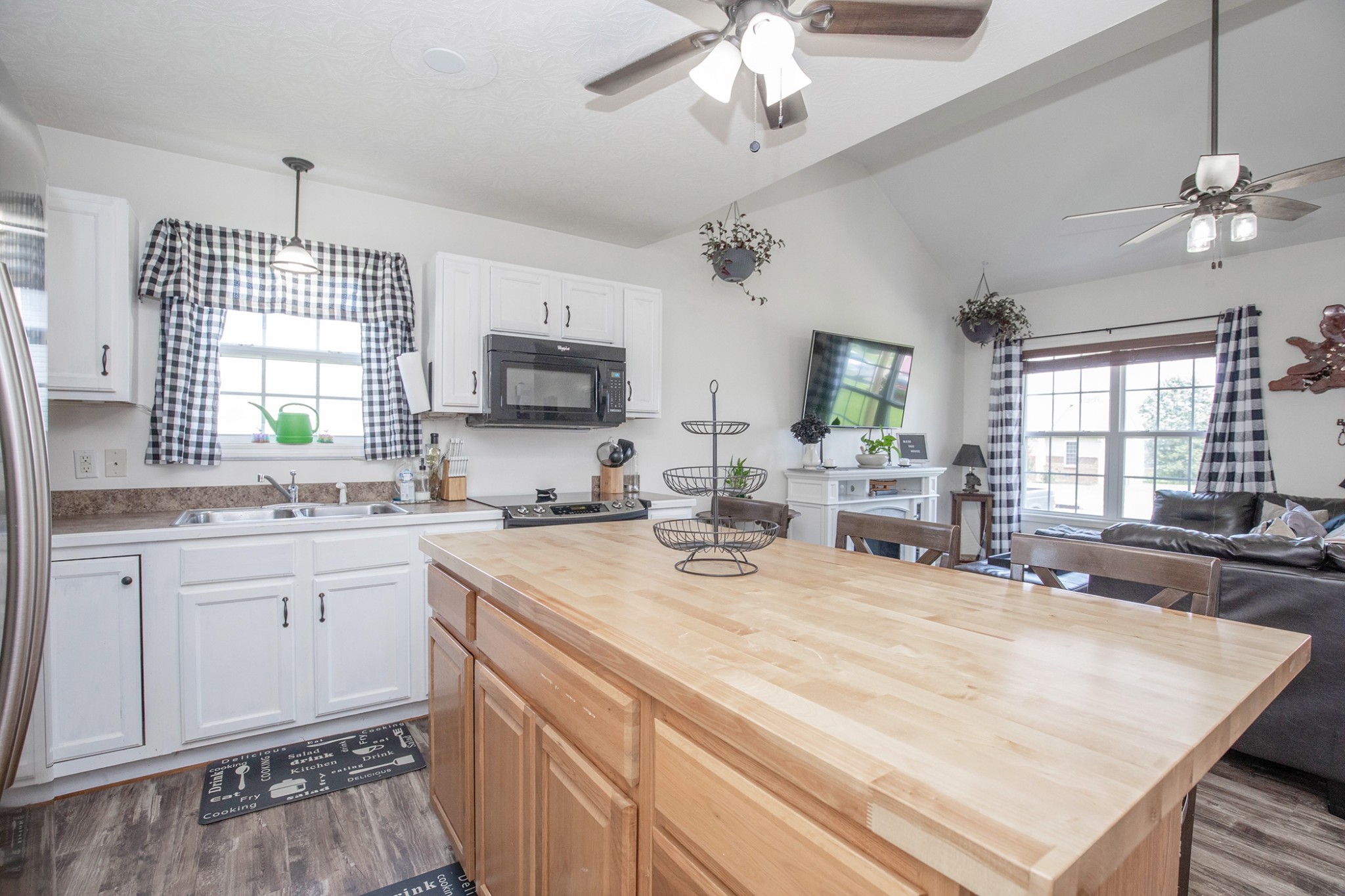 148 Filly Lane Springfield, TN 37172 - Photo 13 of 33 a kitchen with kitchen island granite countertop a sink appliances cabinets and a counter top space