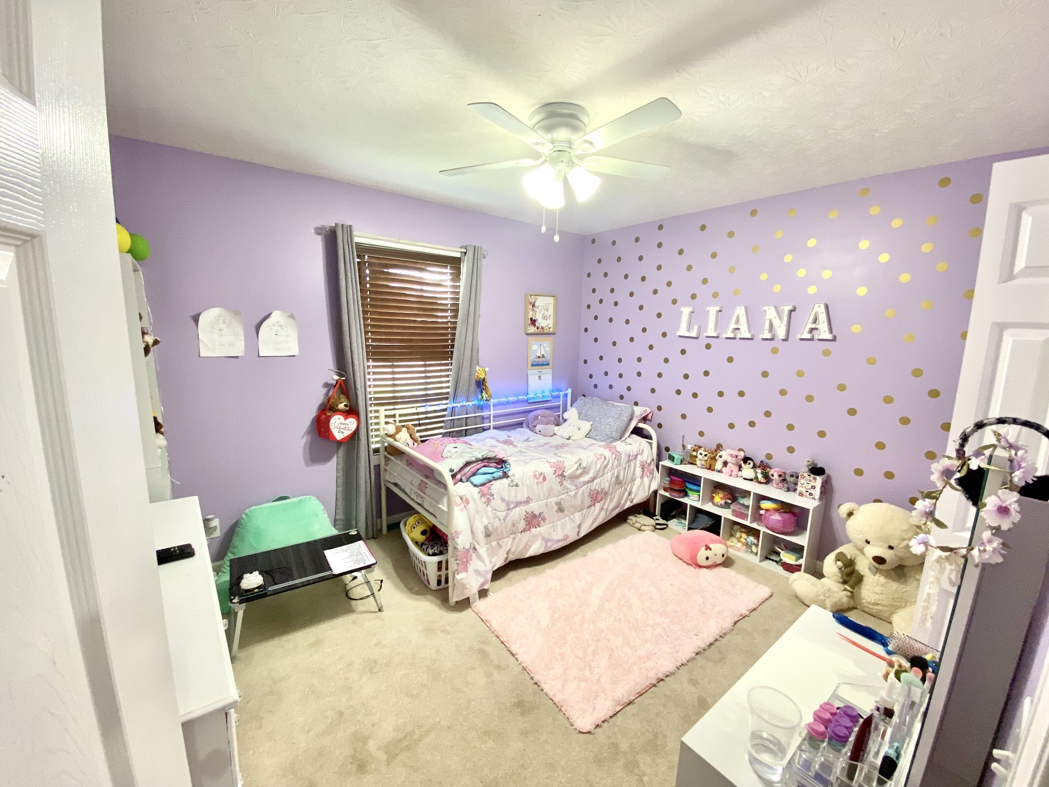 148 Filly Lane Springfield, TN 37172 - Photo 21 of 33 a bedroom with a bed and a chandelier